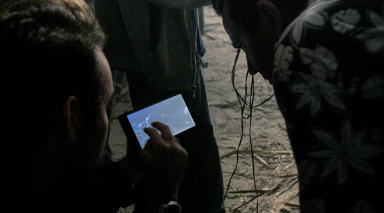 Director Tito da Costa briefing DP Bill Otto on a shot.